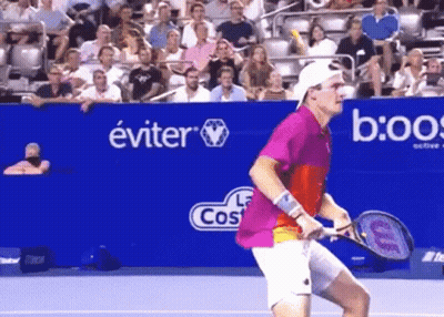 Man In Striped Shirt Holding Tennis Ball GIF