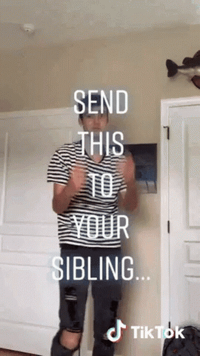 Man In Striped Shirt In Front Of Send This To Your Sibling Door GIF