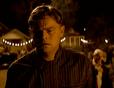 Man In Striped Shirt Looking GIF