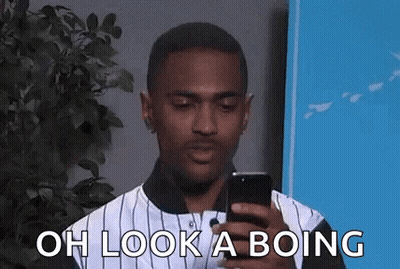 Man In Striped Shirt Looking At Cell Phone GIF