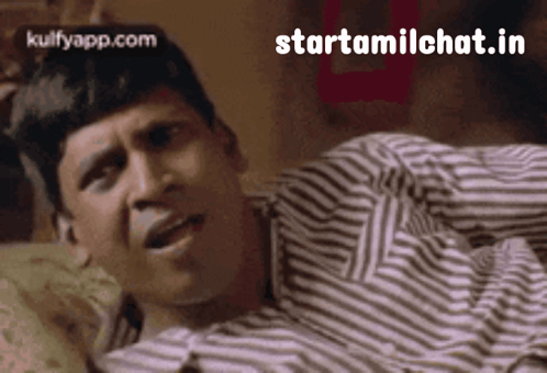 Man In Striped Shirt Lying On Bed GIF