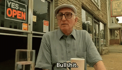 Man In Striped Shirt Making A Face GIF