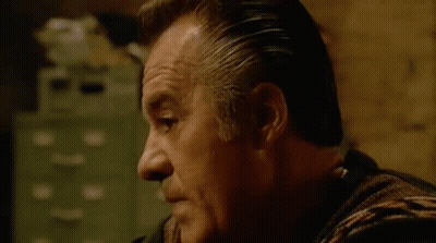 Man In Striped Shirt Making Face GIF