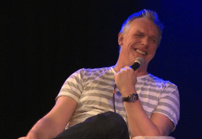 Man In Striped Shirt Making Funny Face GIF