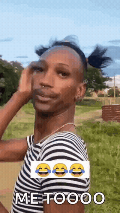 Man In Striped Shirt Making Funny Face In Grassy Field GIF