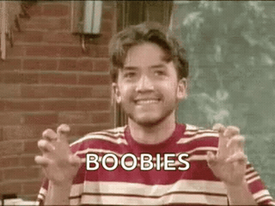 Man In Striped Shirt Making Funny Face Saying Boobs GIF