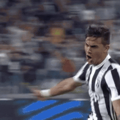 Man In Striped Shirt On Soccer Field Arm Outstretched GIF