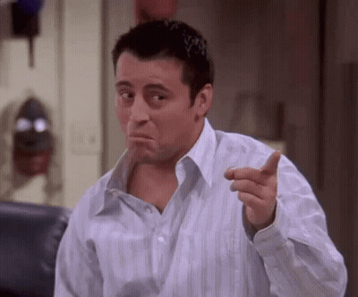Man In Striped Shirt Pointing And Making Face GIF