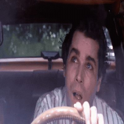 Man In Striped Shirt Sitting In Car With Mouth Open GIF