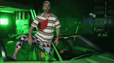 Man In Striped Shirt Sitting In Green Car With Green Light GIF