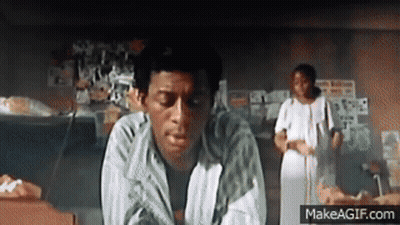 Man In Striped Shirt Sitting With Woman In White Dress GIF