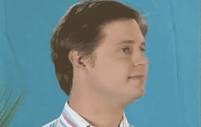 Man In Striped Shirt Smiling Blue Background GIF