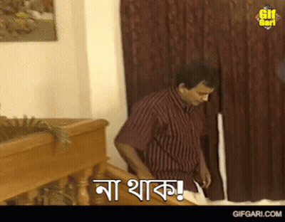 Man In Striped Shirt Standing With Gifgari.com Sign GIF