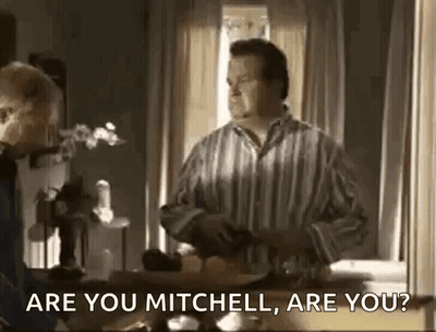 Man In Striped Shirt Talking To Another Man GIF