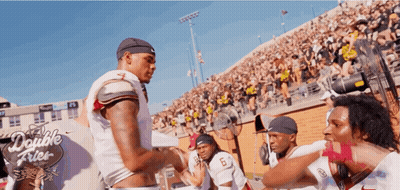 Man In Striped Shirt Talking To Man In Blue Shirt GIF