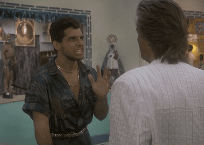 Man In Striped Shirt Talking To Man In Blue Shirt GIF