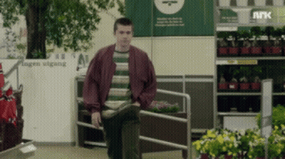 Man In Striped Shirt Walking By Hagen Utgang GIF