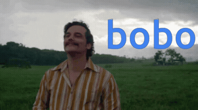 Man In Striped Shirt With Bobo In Field GIF