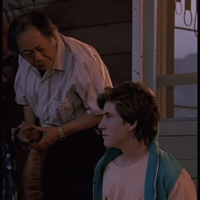 Man In Striped Shirt With Boy In Pink Shirt GIF