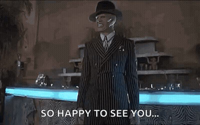 Man In Striped Suit And Hat By Fountain GIF