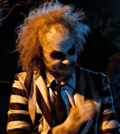 Man In Striped Suit Making A Face GIF