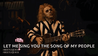Man In Striped Suit Playing Guitar Singing Song Of My People GIF