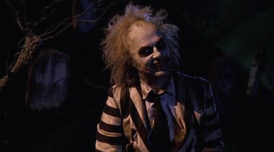 Man In Striped Suit Saying How You Doing In Cemetery GIF