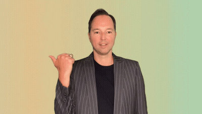 Man In Striped Suit Smiling And Pointing GIF