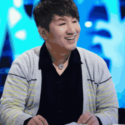 Man In Striped Sweater And Black Shirt Smiling GIF