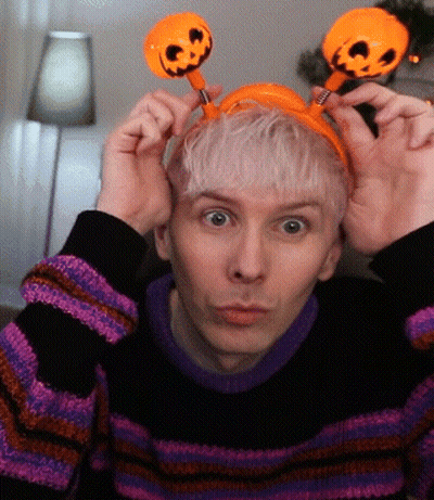Man In Striped Sweater And Pumpkin Headband GIF