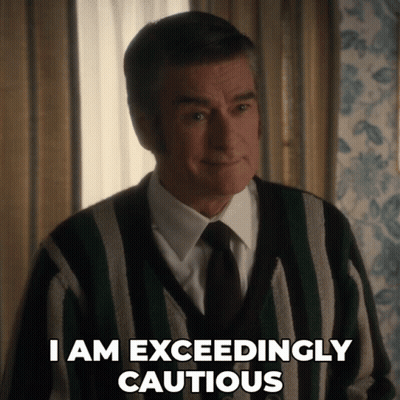 Man In Striped Sweater And Tie Saying I Am Exceedingly Cautious GIF