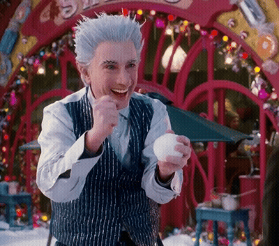 Man In Striped Vest Holding White Ball Smiling GIF