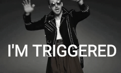 Man In Studded Jacket And Sunglasses Says I'm Triggered GIF