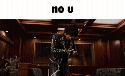 Man In Studded Leather Jacket Holding Gun GIF