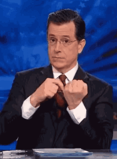 Man In Suit Adjusting Tie GIF