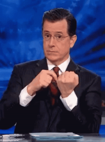 Man In Suit Adjusting Tie GIF