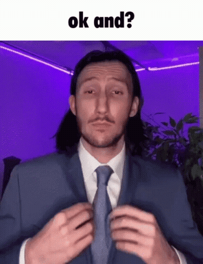 Man In Suit Adjusting Tie Saying OK And GIF