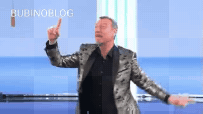 Man In Suit And Black Shirt Dancing Pointing Up GIF