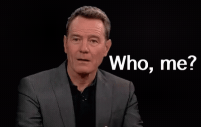 Man In Suit And Black Shirt Saying Who Me GIF