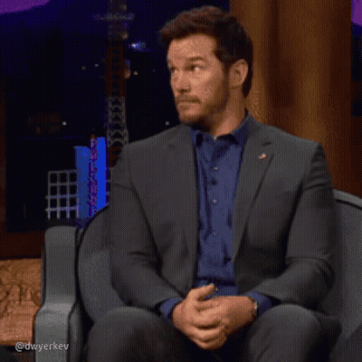 Man In Suit And Blue Shirt Laughing GIF