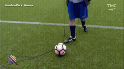 Man In Suit And Blue Shorts On Soccer Field GIF