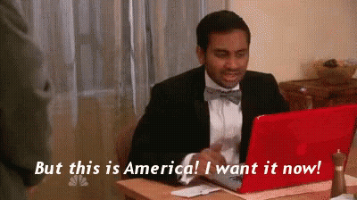 Man In Suit And Bow Tie At Red Laptop Saying But This Is America I Want It Now GIF