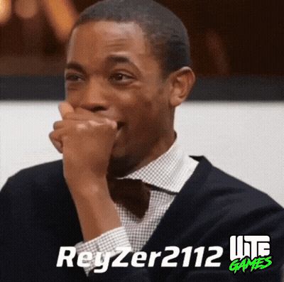 Man in Suit and Bow Tie Covering Mouth With Reyzer2112 Lite Games