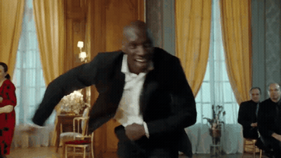 Man In Suit And Bow Tie Dancing GIF
