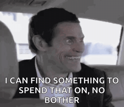 Man In Suit And Bow Tie In Back Seat GIF