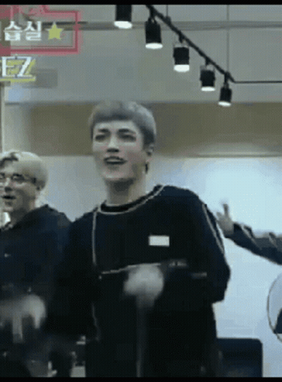 Man In Suit And Bow Tie In Front Of Crowd GIF