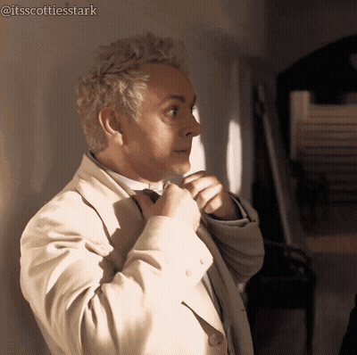 Man In Suit And Bow Tie In Front Of Ncuti Gatwa Sign GIF