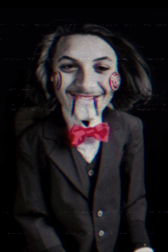 Man in Suit and Bow Tie Like Saw Puppet