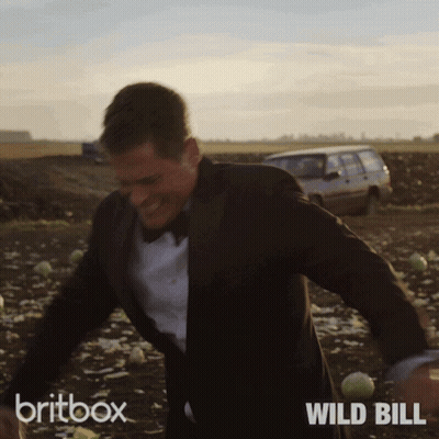 Man In Suit And Bow Tie Running Britbox Wild Bill GIF