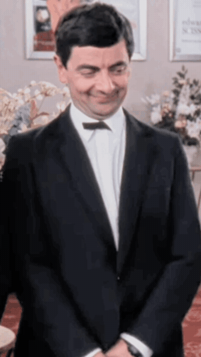 Man In Suit And Bow Tie Smiling GIF